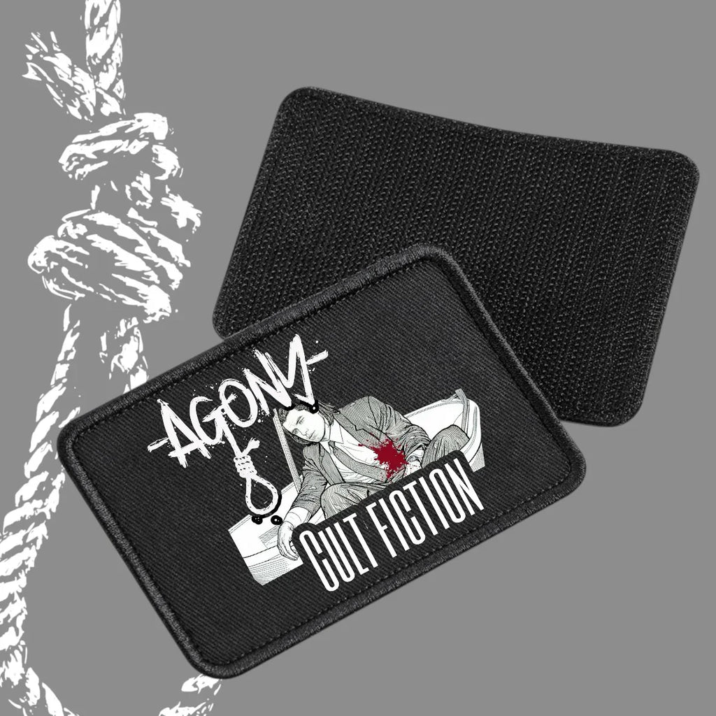 Patch Agony Clothing 'Cult Fiction' brodé, style streetwear dark, motif homme blessé, fond gris.
